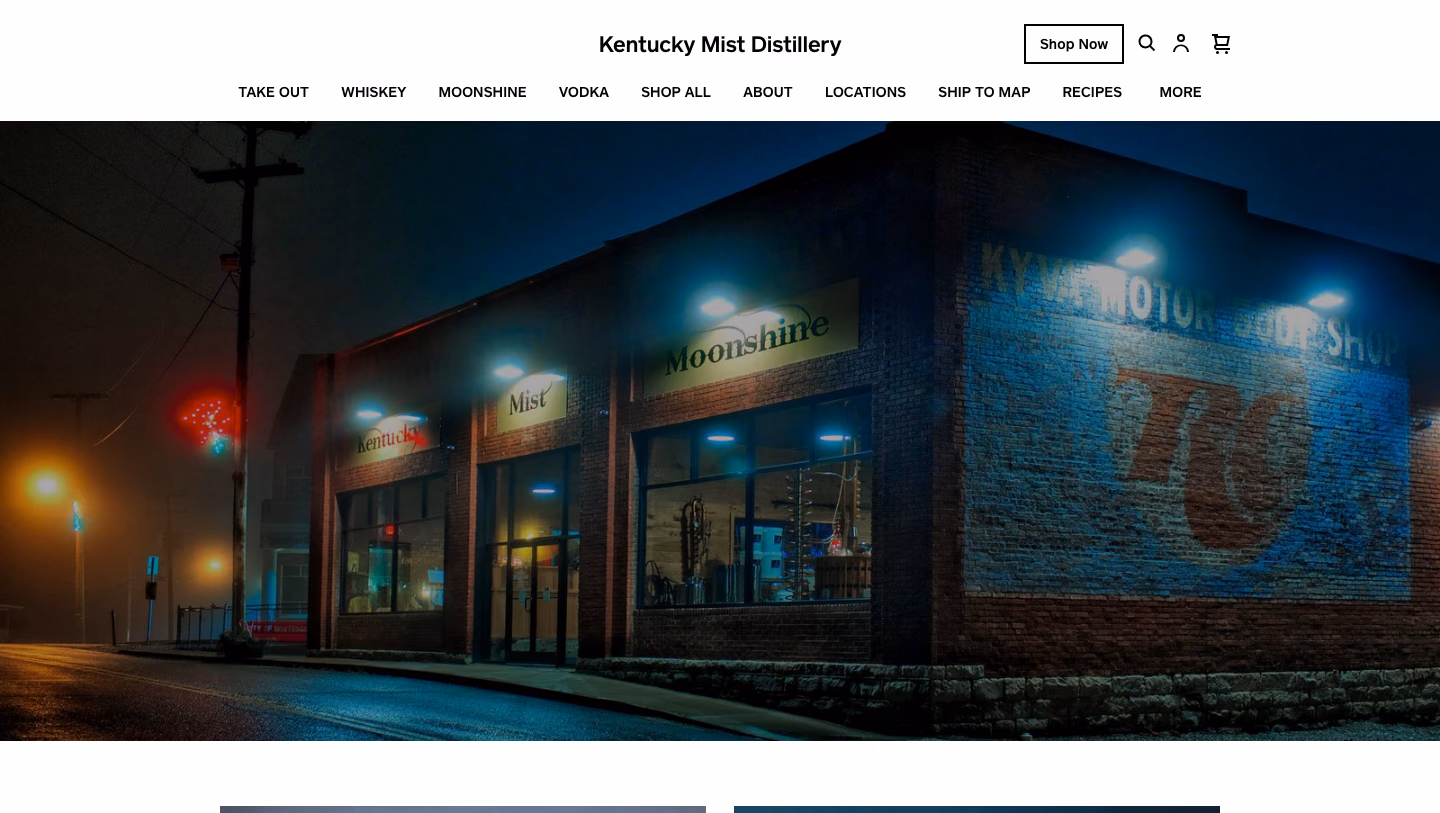 Kentucky Mist Distillery homepage featuring its nighttime storefront
